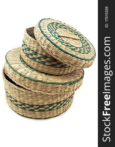 Wicker container bins stacked over white background.