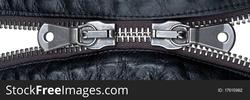 Metal double zipper lock in unzip leather jacket. close-up