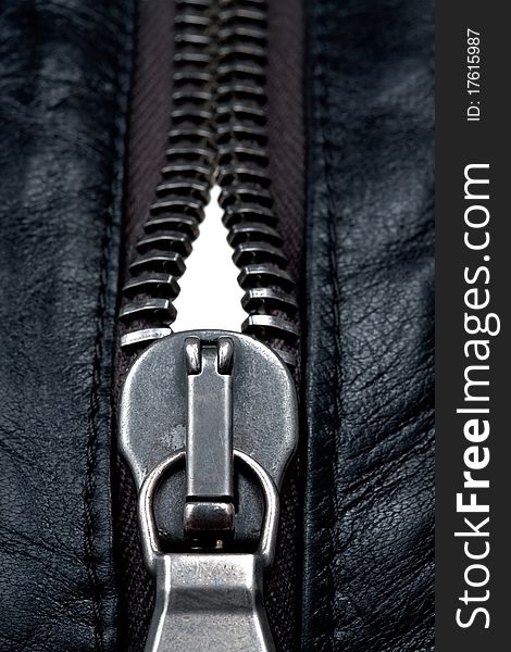 Metal zipper lock in black leather jacket. close-up