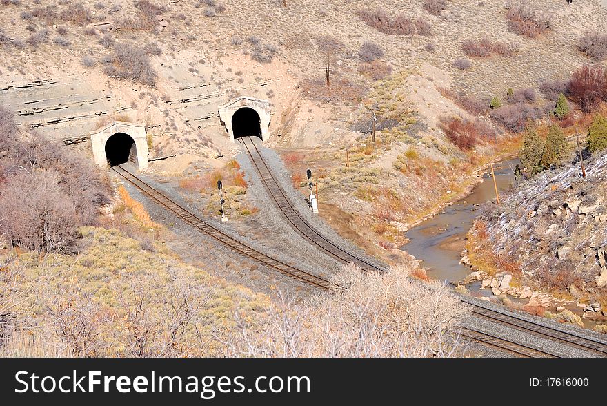 Dual Railroad Tunnels in Desert Canyon