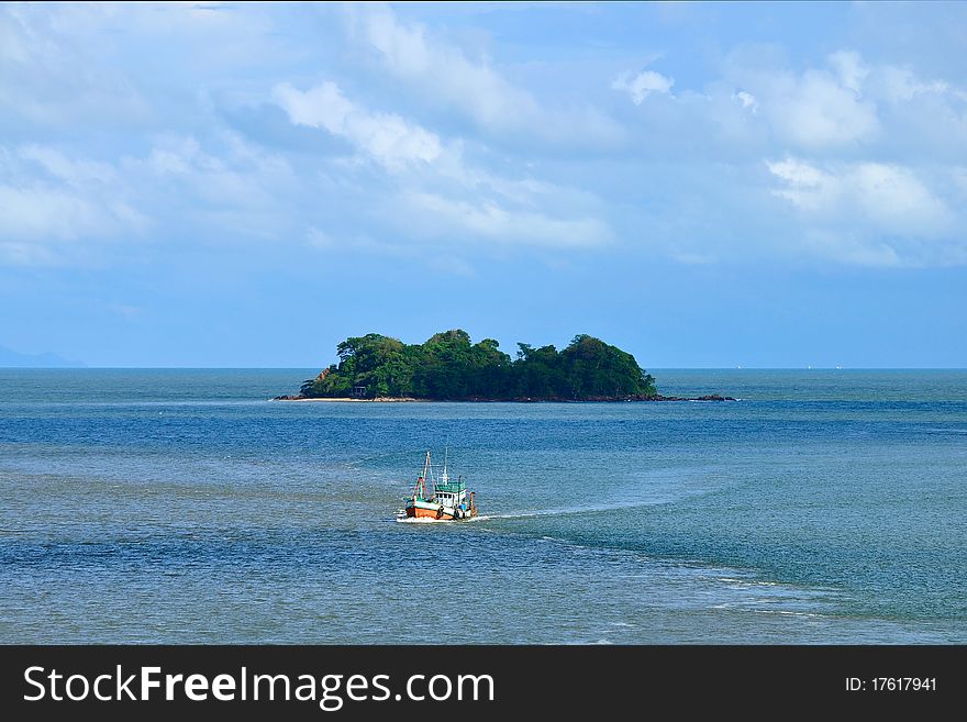 Fisherman boat and island