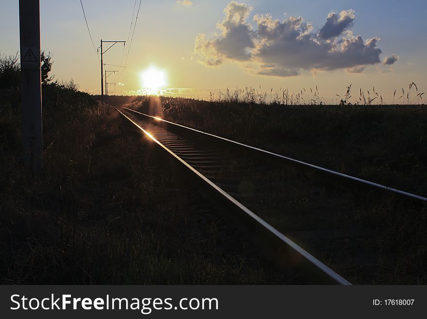 Railway with the summer sunset