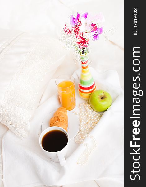 Cup of coffe and flower in vase on tray. Cup of coffe and flower in vase on tray