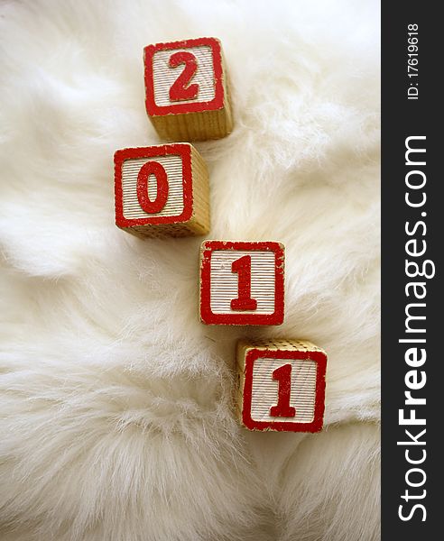Calendar year 2011 on white fluffy background. Calendar year 2011 on white fluffy background