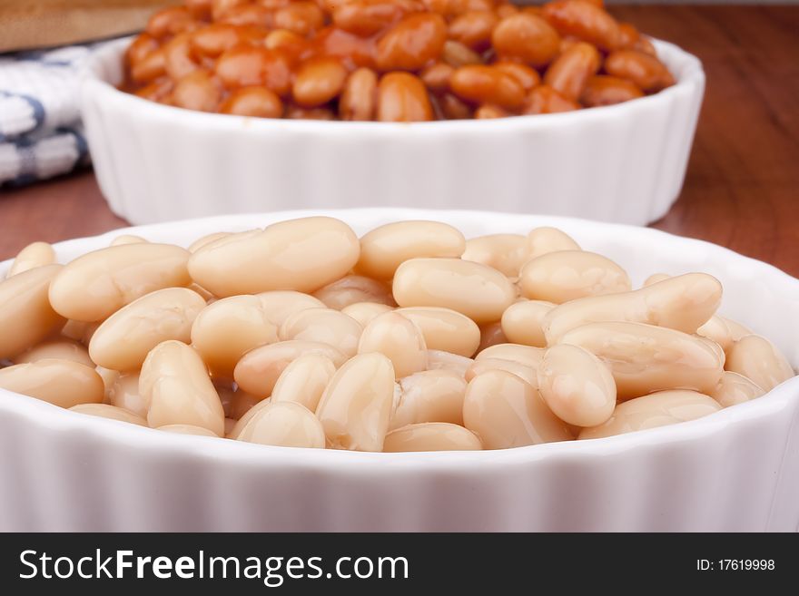 White canned beans in a white ceramic dish. White canned beans in a white ceramic dish.