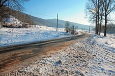 Curved Road Covered By Snow Stock Images