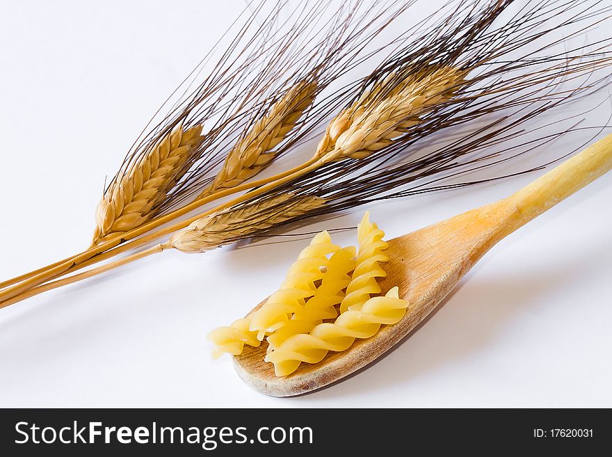 Closeup of italian food and natural spike on white background. Closeup of italian food and natural spike on white background