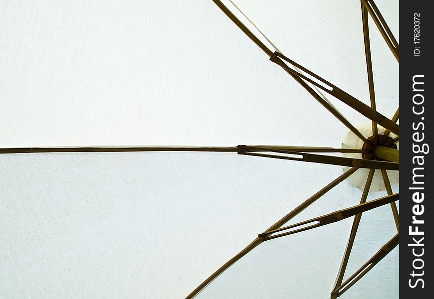 Fabric and wooden handmade umbrella background