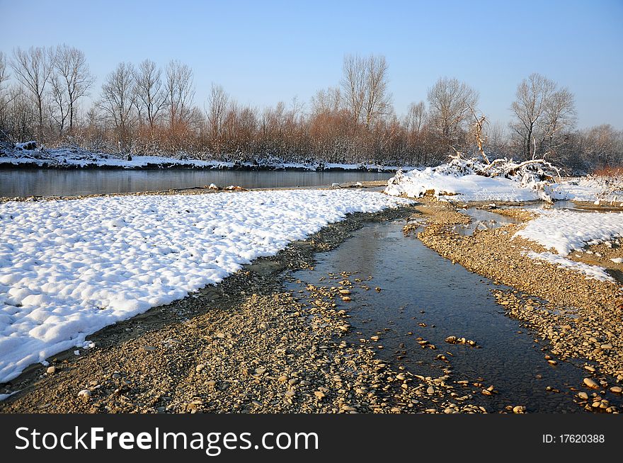 Frosty river in sunny winter day