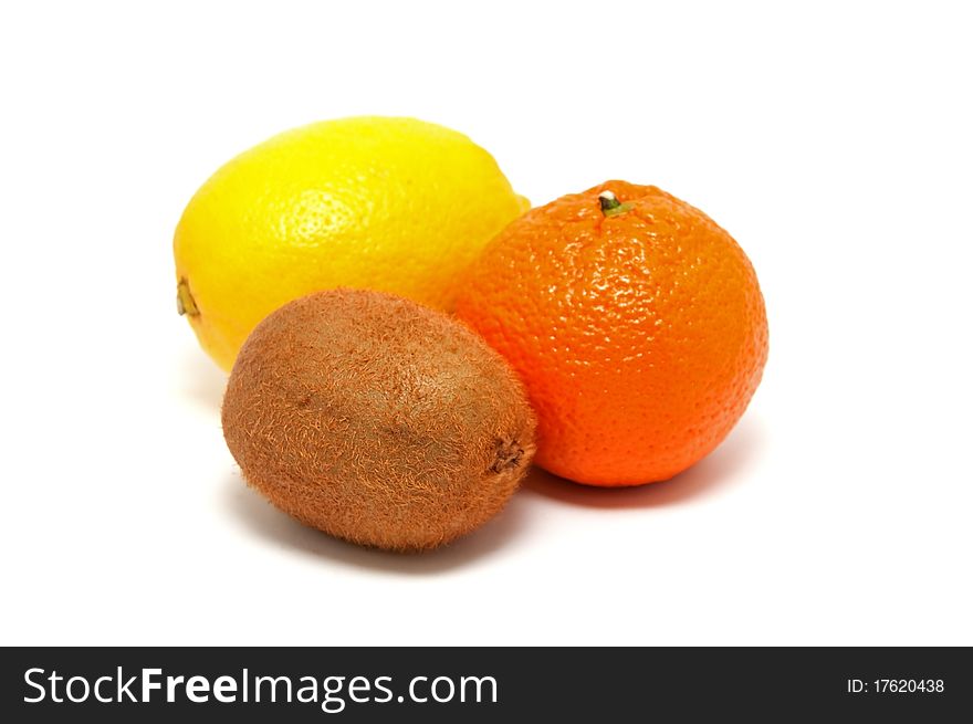 Kiwi, lemon and tangerine on a white background