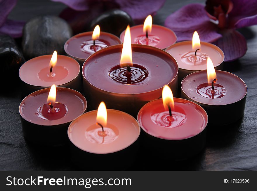 Lighted candles on a black background. Lighted candles on a black background