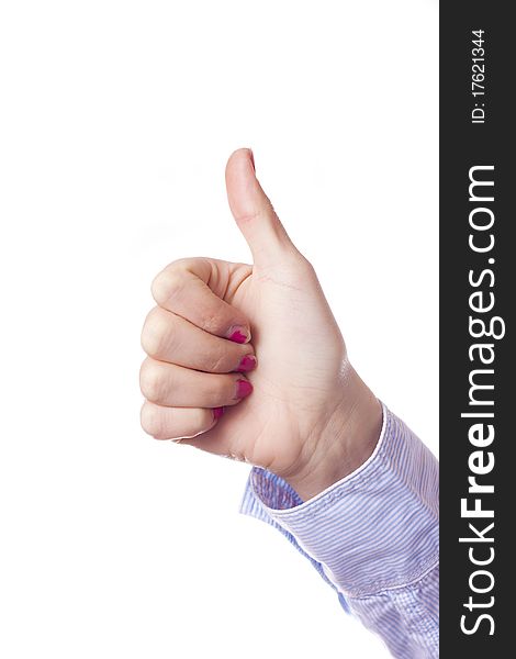 A woman's hand giving thumbs up. Model wearing a button up shirt and pink nail polish. High key portrait on a white background.