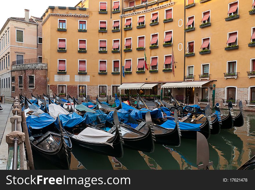 Lots of gondolas moored at the canal in Venice, Italy. Lots of gondolas moored at the canal in Venice, Italy