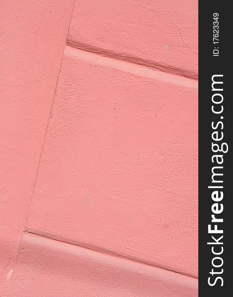 The pink colored walls with texture