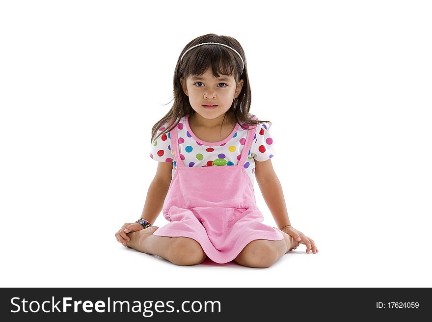 Cute little girl sitting isolated on white background. Cute little girl sitting isolated on white background