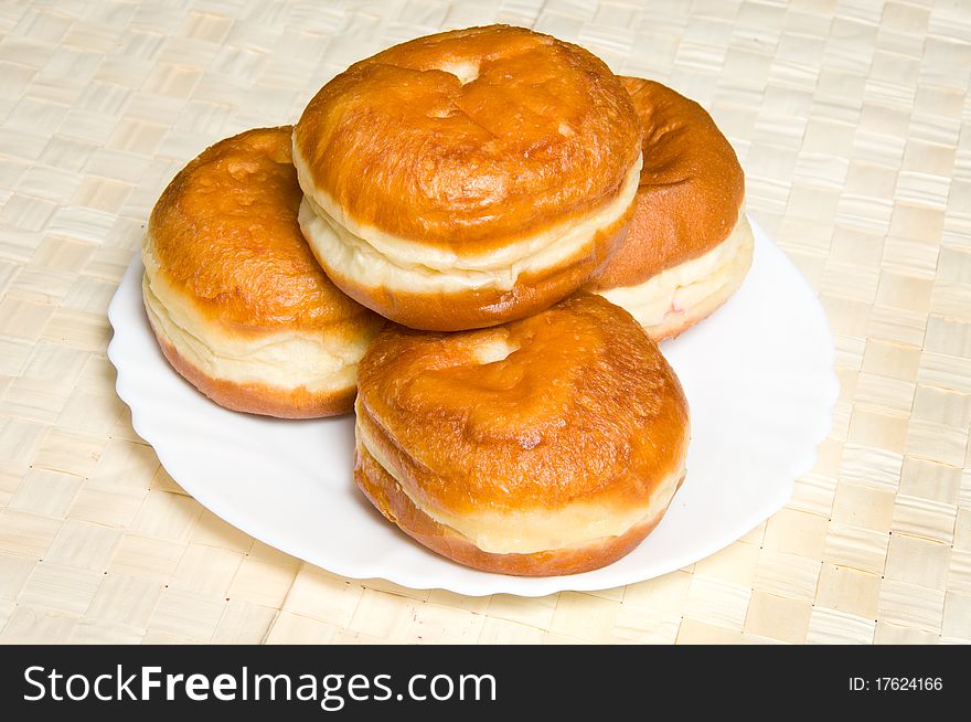 Four appetizing doughnuts on plate