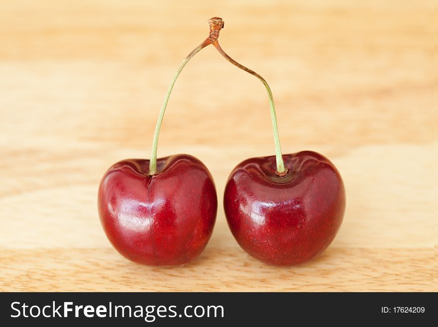 Cherries on a wooden background