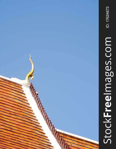 Thailand temple's roof with golden naga decorated. Thailand temple's roof with golden naga decorated.