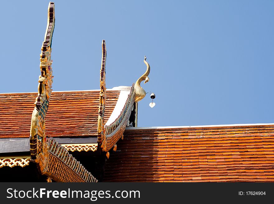 Thailand temple's roof with golden naga decorated. Thailand temple's roof with golden naga decorated.