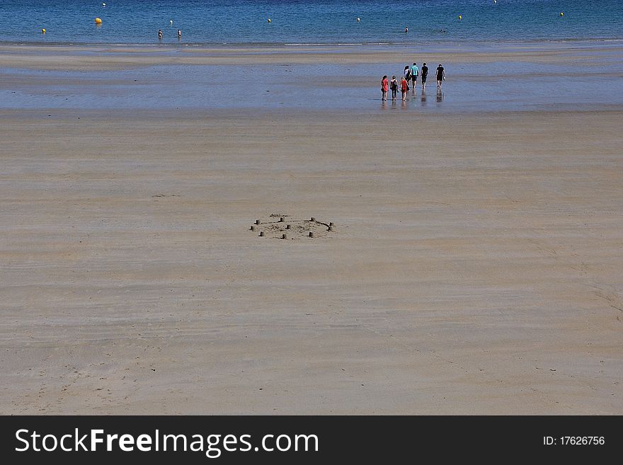 A construction with the sand in a large breton beach during the low tide. A construction with the sand in a large breton beach during the low tide