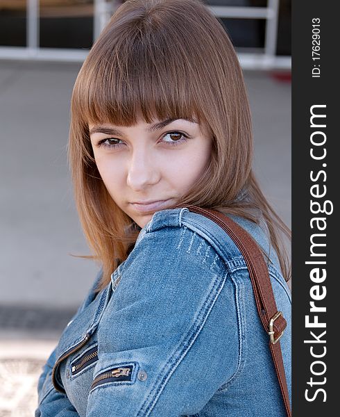 Portrait of a young girl in a denim jacket