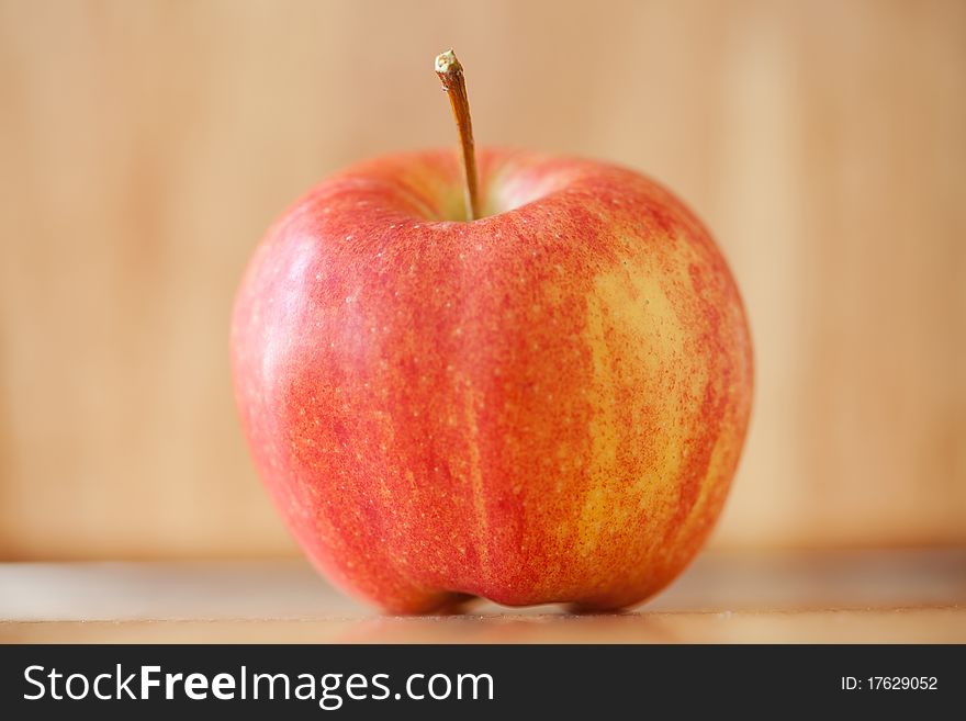 Red Apple On Rustic Wood