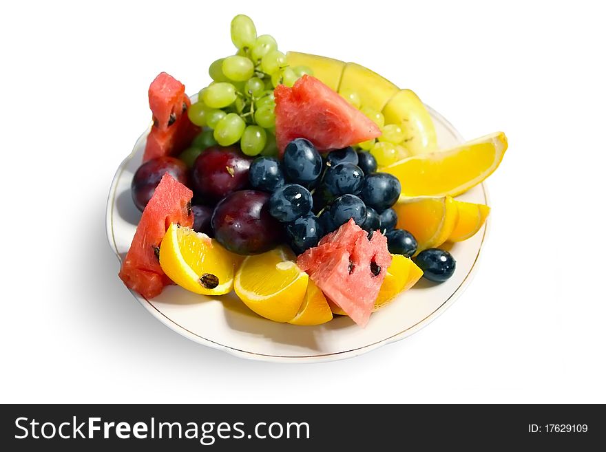 A lot of fruits on plate. A lot of fruits on plate