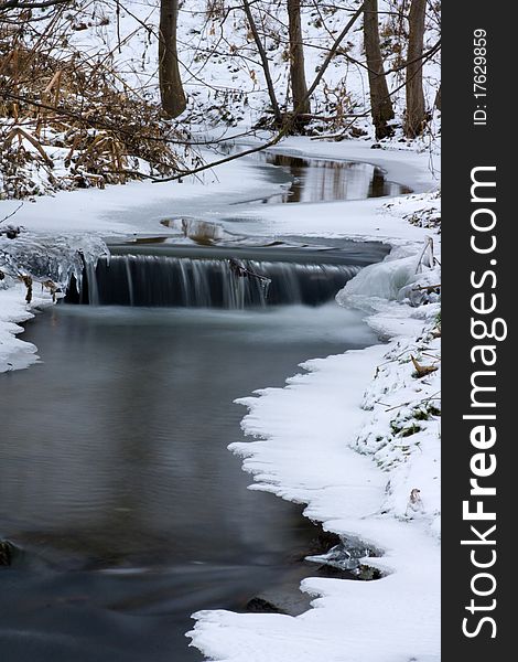 Small creek stream covered with ice. Small creek stream covered with ice