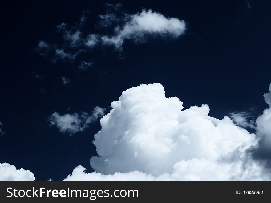 White clouds and dark sky. White clouds and dark sky