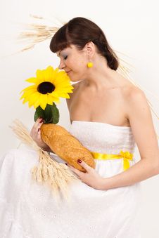 Girl With Bread, Sunflower And Ears Of Wheat Stock Photo Girl With Bread, Sunflower And Ears Of Wheat Stock Photo