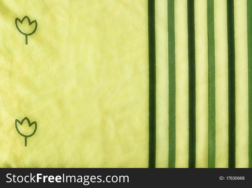 Yellow fabric with green flowers and lines