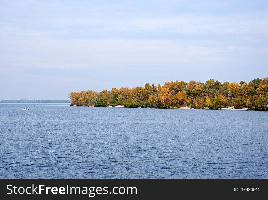 Colorful autumn trees at the river bank. Colorful autumn trees at the river bank