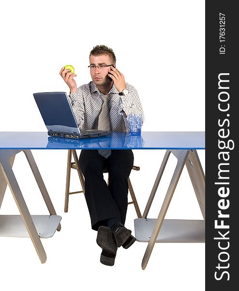 Elegant man sits at his desk. Businessman talking on the phone.