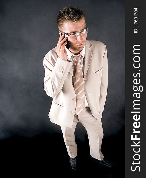 Elegant businessman working on his office and  smoking cigar. Elegant businessman working on his office and  smoking cigar.