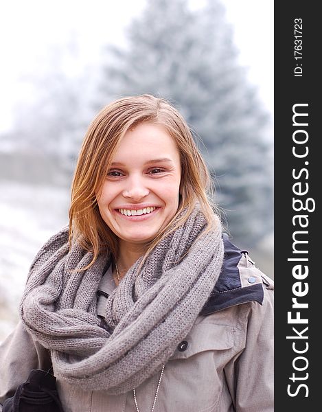 Outdoor winter portrait of a beautiful young woman