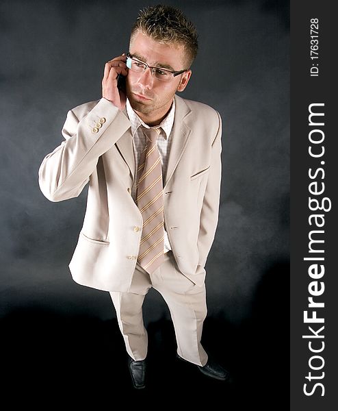 Elegant businessman working on his office and  smoking cigar. Elegant businessman working on his office and  smoking cigar.