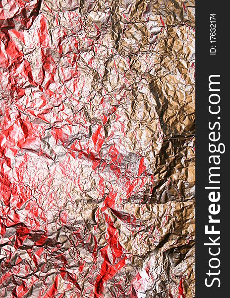 Gold foil background with red light. Gold foil background with red light