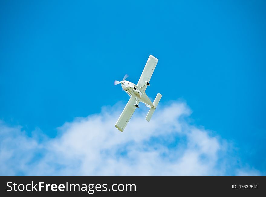AT-3 type airplane flying through sky with clouds. AT-3 type airplane flying through sky with clouds