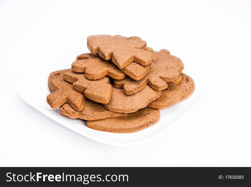 Plate of tasty homemade gingerbread cookies on isolating background. Plate of tasty homemade gingerbread cookies on isolating background