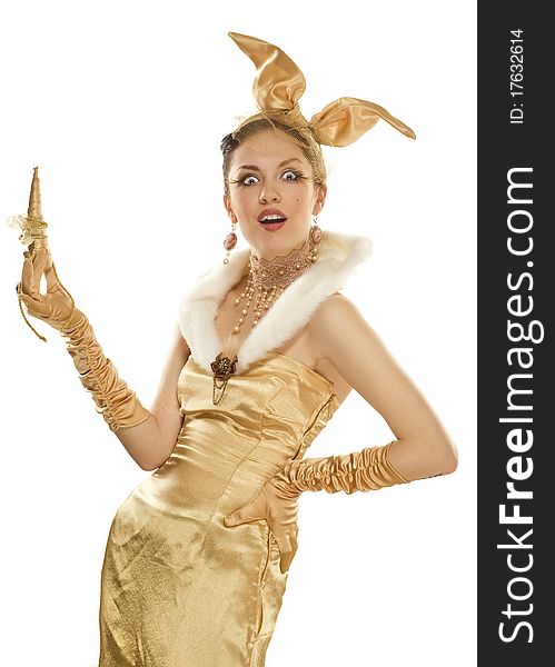 Beautiful girl dressed up as a gold rabbit on white background