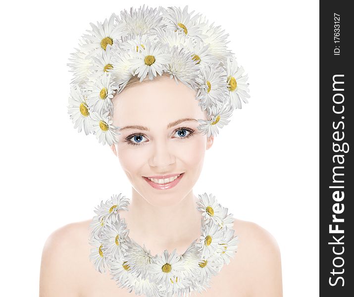 Natural beauty girl with good skin smiles the head and neck decoration of daisies. Natural beauty girl with good skin smiles the head and neck decoration of daisies