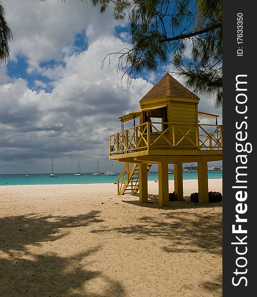 A yellow lifeguard watch tower on Barbados. A yellow lifeguard watch tower on Barbados.