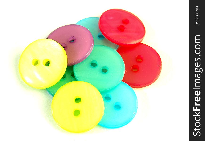 Isolate of colorful cloth buttons on white background
