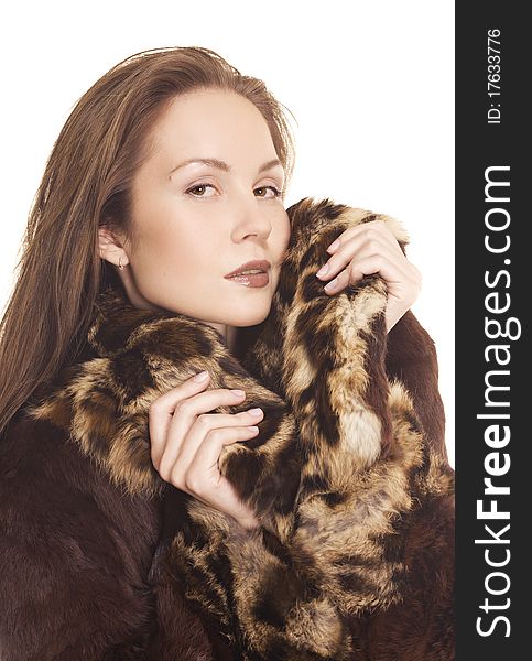 Beautiful girl in fur coat on white background. Beautiful girl in fur coat on white background