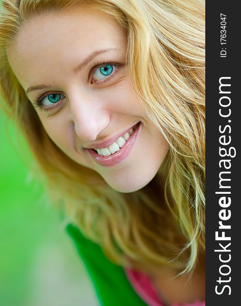 Close-up portrait of young blonde. Very small depth of field. Close-up portrait of young blonde. Very small depth of field.