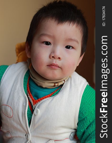 Lovely chinese boy in the winter day