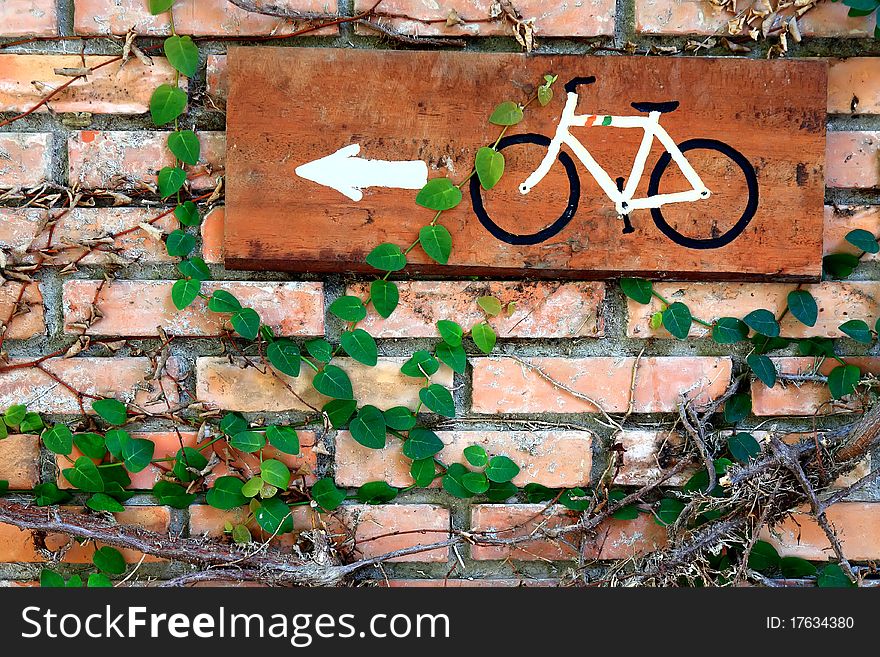 Brick wall with bicycle plate for environment