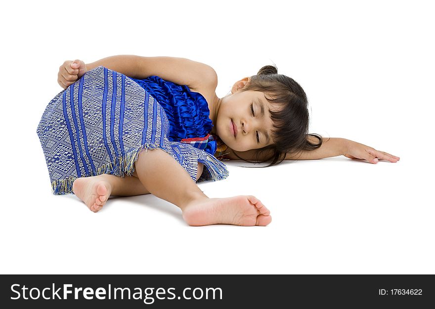 Cute little girl laying on the floor with eyes closed, isolated on white background. Cute little girl laying on the floor with eyes closed, isolated on white background