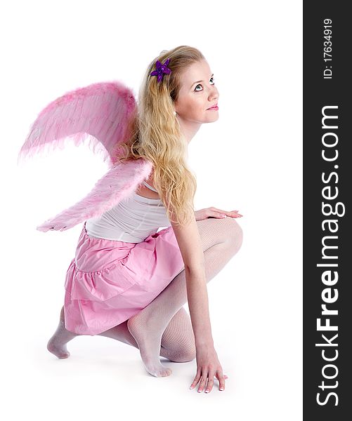 Young blond woman with wings. Isolated on white background. Young blond woman with wings. Isolated on white background