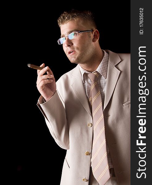 Businessman smoking cigar